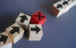 Wooden blocks with arrow and error icon